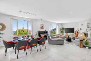 a large living room with a table and chairs at Villa Panorama in Éze
