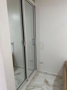 a shower with a glass door in a bathroom at SahiR 2 in Cantabria
