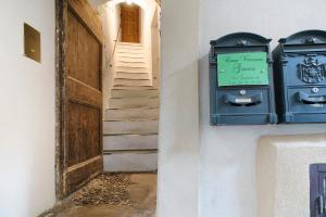 a stairway with a sign on the side of a building at Casa Gianni in Vallebona
