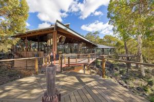 a building with a wooden deck with at The Hills Opera House in Bickley