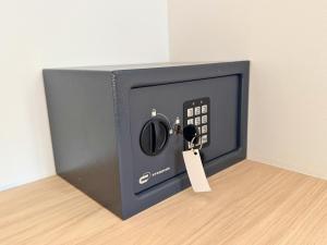 a small tv with a tag attached to it at YourHouse As Escadas in Allariz