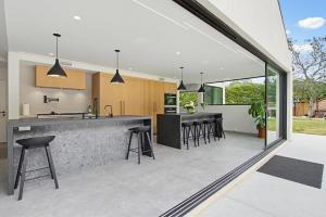 an open kitchen and dining area of a house at Modern Encinitas Retreat in Encinitas