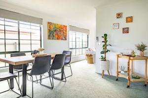 a dining room with a table and chairs at Nautilus Nest - Port Sorell in Port Sorell