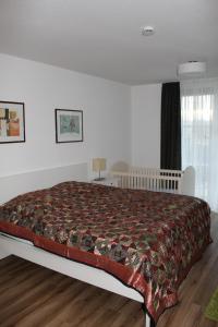 Кровать или кровати в номере Dreiländerblick