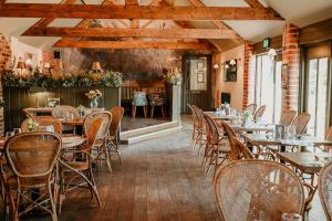 a restaurant with tables and chairs in a room at The Bubble at Stenson in Stanton +42 photos