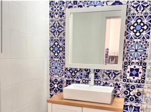a bathroom with a sink and a mirror at Marina View in Ashkelon +9 photos