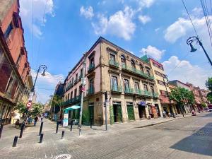 an old building on the side of a street at Casa Regina CDMX in Mexico City