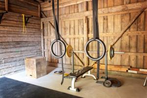a fitness room with a gym with weights at Stay North - Mustio in Inkoo