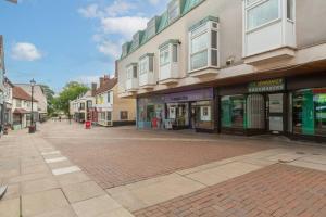 an empty street in a town with buildings at Smart TV, Nespresso machine, Self Check-In in Potter Street