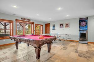 a room with a pool table and two tables at Ace of Diamonds in Seven Devils