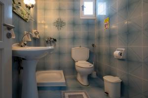 a bathroom with a toilet and a sink at Nautilus Apartments in Sisi