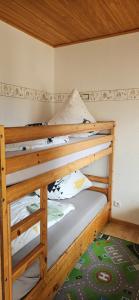 a bunk bed in a small room with a bunk bedscribed at Jasmin mit Sauna und Schwimmbad in Hohegeiß +21 photos
