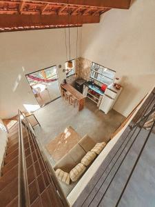 an overhead view of a living room with a couch at Girassóis do Vale - Chalés no Vale do Capão in Caeté-Açu