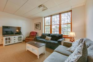 a living room with two couches and a flat screen tv at Work, Play & Explore: 9-Unit New Kensington Base in New Kensington