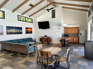 a living room with a couch and a table at Winners Circle Solana Beach Del Mar Resort in Solana Beach