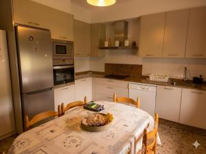 a kitchen with a table with a bowl of food on it at A Veiga Grande in Pontevedra