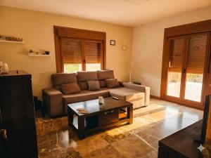 a living room with a couch and a coffee table at A Veiga Grande in Pontevedra