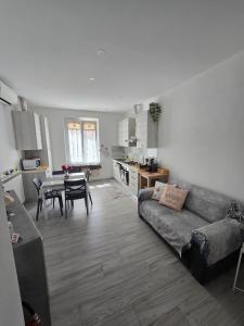 a living room with a couch and a table at La Casa di Nonna Mari in Moneglia