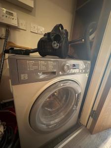 a camera sitting on top of a washing machine at Central Sheffield Studio for 2 in Sheffield
