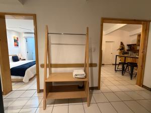 a room with a bunk bed and a room with a bedroom at Suites Xico Oaxaca in Oaxaca City