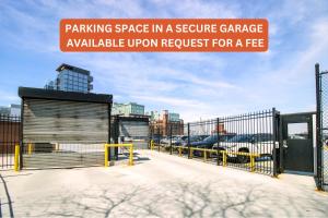 a sign that reads parking space in a sequence garage available urban request for a fee at North End Entire House in Boston