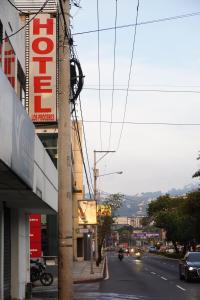 a street with a sign on the side of a building at Hotel Los Proceres in La Aurora
