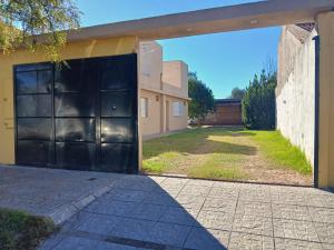 a large black garage door on a building at Depto Manzur in Villa Mercedes