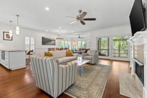 a living room with a couch and a fireplace at 1005 Crooked Oak Lane in Seabrook Island