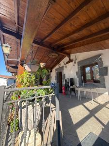 a porch of a house with a wooden roof at Izarra Urdaneta in Aizarna