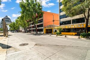 an empty street in front of a building at Hotel Arizona in Mexico City