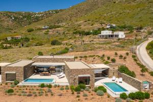 an aerial view of a house with a swimming pool at Gray and Blue in Andros