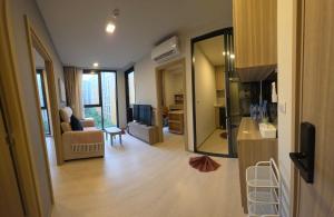 a living room with a couch and a television at The Rock Condo Central Phuket "Min-1 week" in Ban Rangeng +14 photos