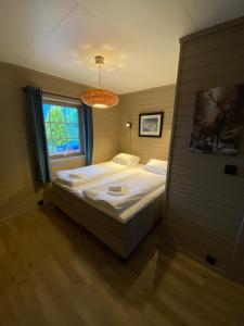 a bedroom with a bed and a window at Charming view in Olden