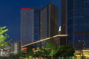 a group of tall buildings in a city at night at Sheraton Nanchang Hotel in Nanchang