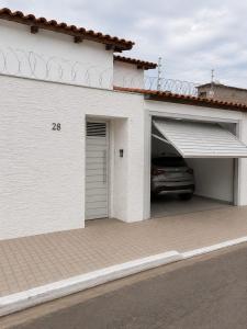 a garage with a car parked inside of it at Pousada Emanuel in Paracatu