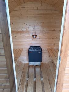 a inside of a sauna with a cooler in it at Domki Marianowo in Marianowo