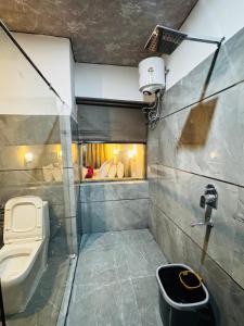 a bathroom with a toilet and a sink at Arhat Resort in Deskit +31 photos