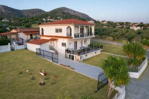 an aerial view of a house with a yard at Villa Aelia Luxury Maisonette in Salamina