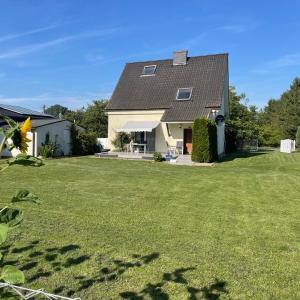 a house with a large lawn in front of it at Haus Mediterran in Kamień Pomorski