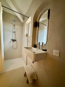 a bathroom with a sink and a mirror at Le jardin suspendu in Gordes +17 photos
