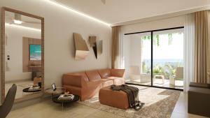 a living room with a couch and a table at Blue Monkey Hotel & Beach Club in Saint James