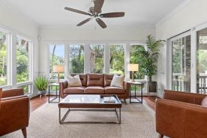 a living room with a couch and a ceiling fan at 1005 Crooked Oak Lane in Seabrook Island
