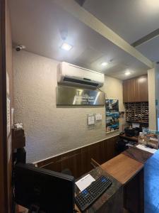 a waiting room with a cash register and a desk at Downtown Santana Hotel in Rio de Janeiro