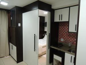 a room with a bathroom with a bed and a kitchen at Life Resort in Brasília