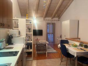 a kitchen with a table and a dining room at Takoma Hvar in Hvar