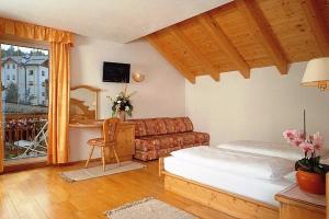 Postel nebo postele na pokoji v ubytování Hotel San Leonardo