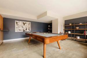 a living room with a pool table in it at Global Luxury Suites at Georgetown in Washington, D.C.
