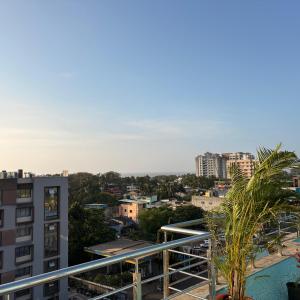 a view of the city from the balcony of a building at Rooftopwaves penthouse in Daman