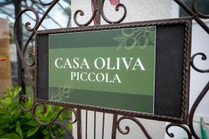 a sign that reads casa oliva pucola on a gate at Casa Oliva Tokaj in Tokaj