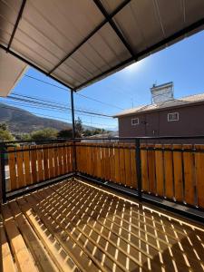 a large deck with a roof with a view at Hostal JV CASA AMPLIA in Nogales